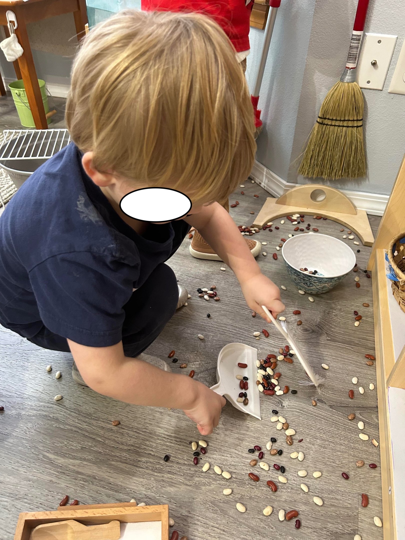 Child practicing a practical life activity