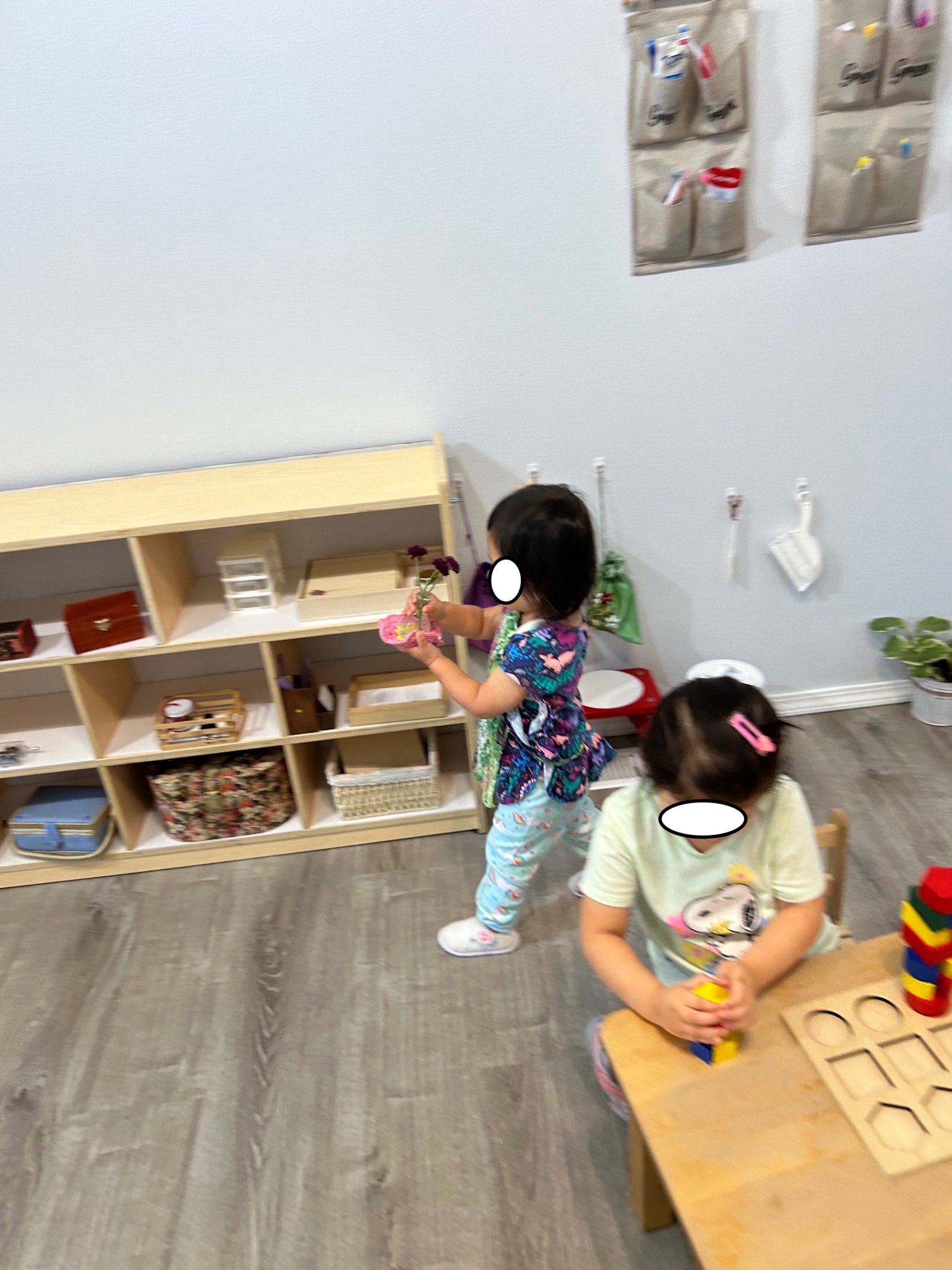 Children working with flowers and classroom materials