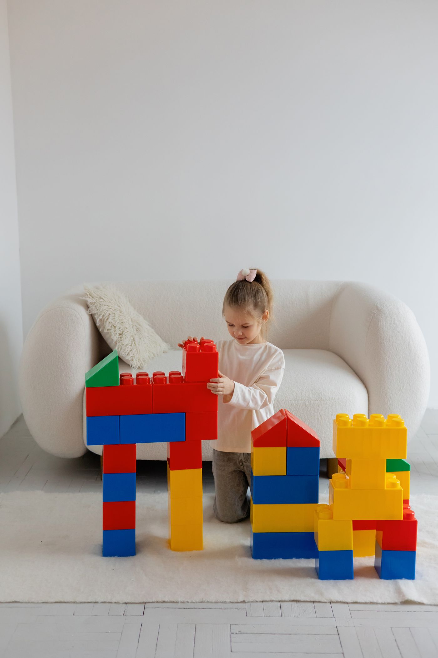 Child building with colorful blocks